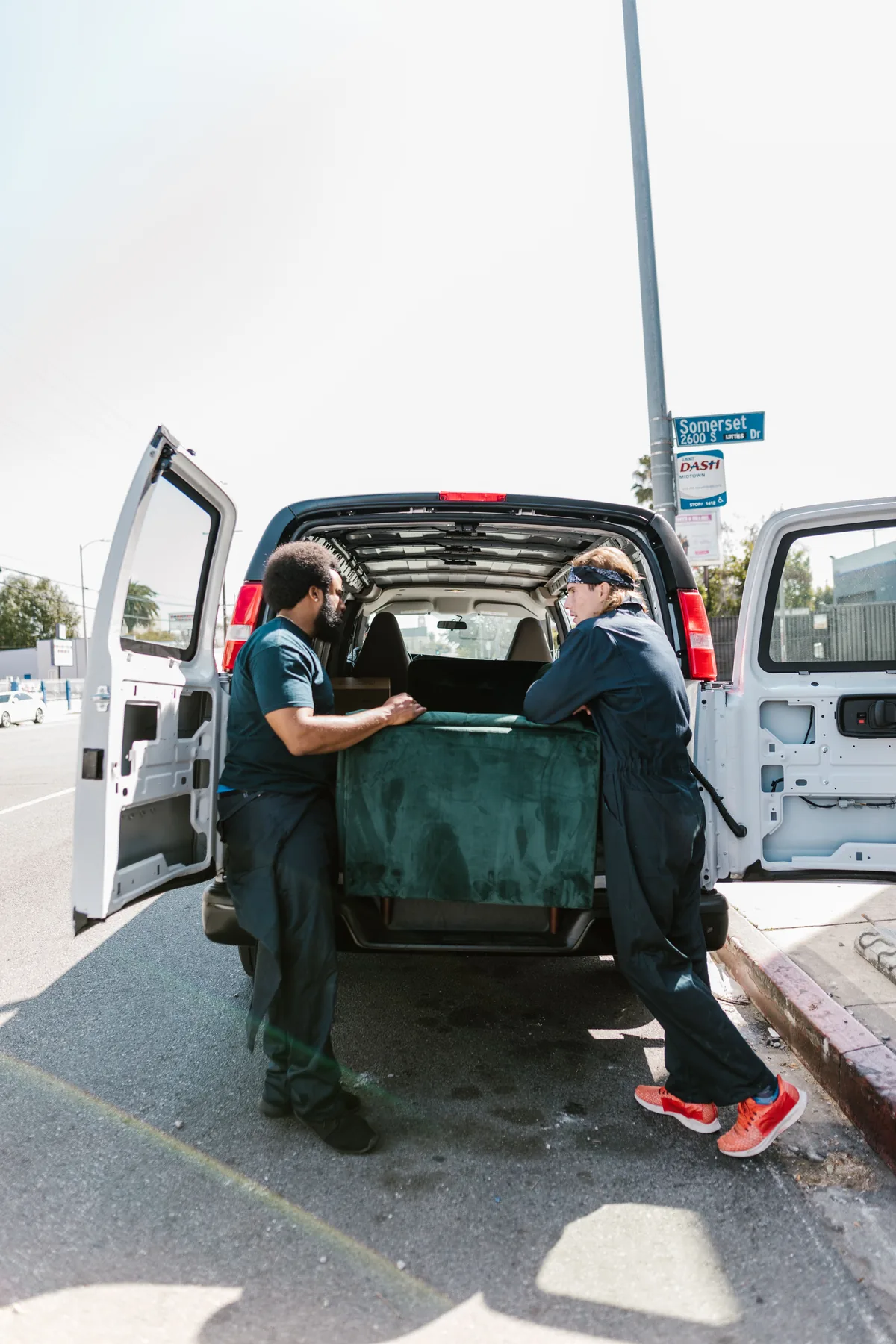 Movers loading furniture into van